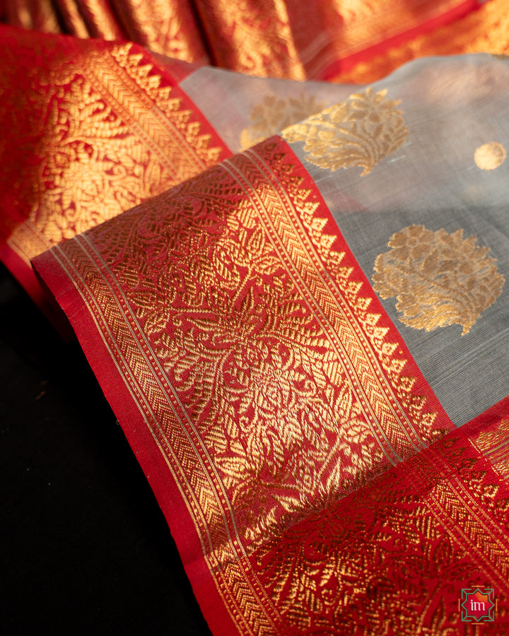 Elegant grey silk saree, where in the detailed saree print is displayed.