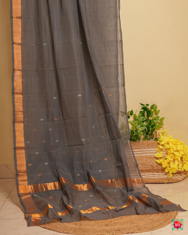 Grey handloom cotton saree  is displayed.