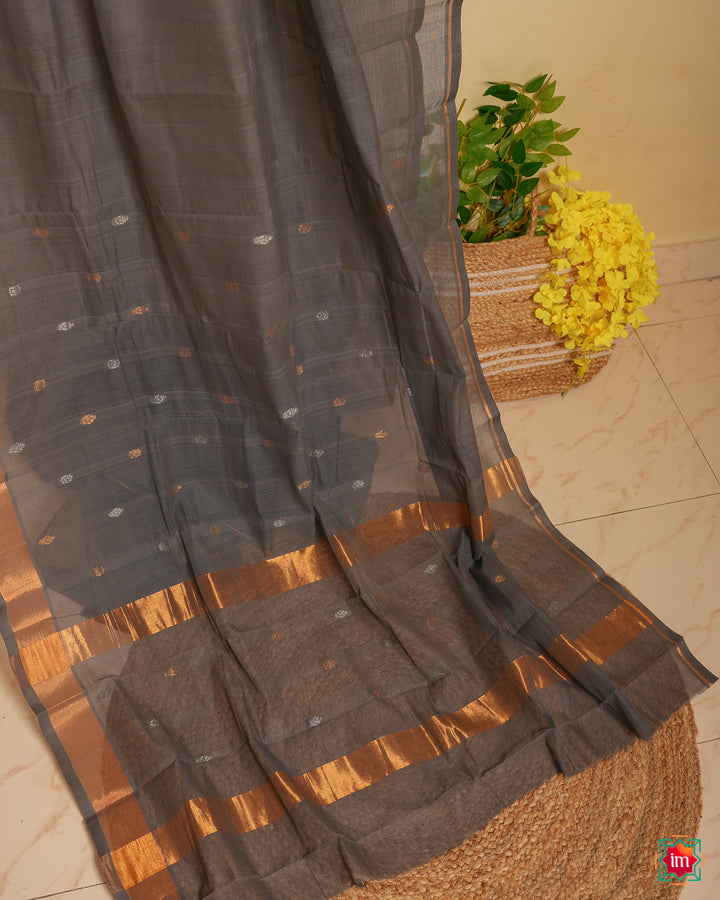 Grey handloom cotton saree is displayed.