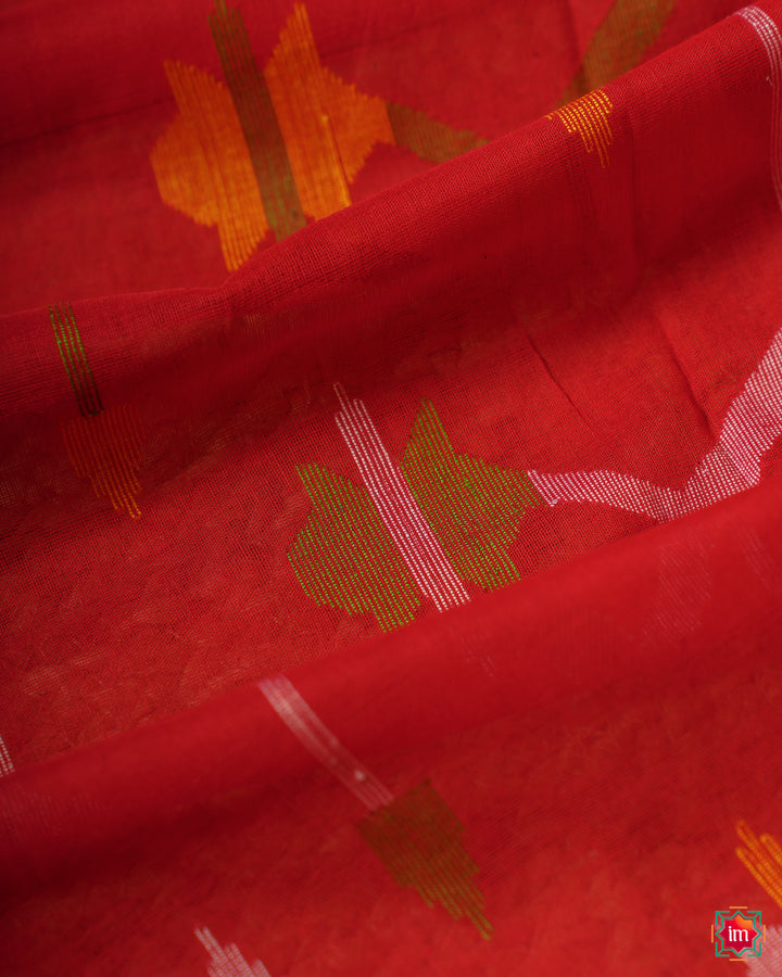 Red handloom saree, where in the detailed saree print is displayed.