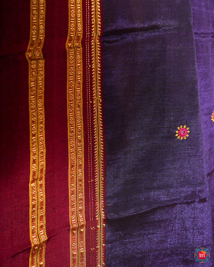 Purple saree, where in the detailed saree print is displayed.