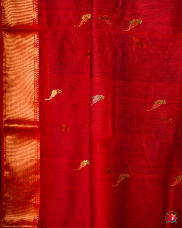 Red handloom cotton saree is displayed.